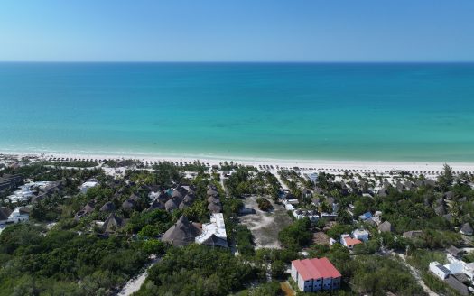 Holbox investment land for sale — aerial view of Lotes Paraíso 150 m² titled lots 400 meters from the Caribbean Sea