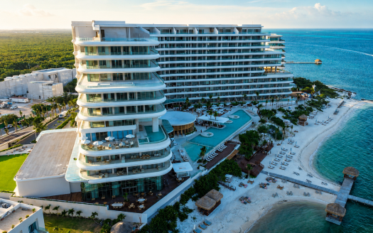 Costa Mujeres luxury real estate, aerial view of The St. Regis resort tower and private beach